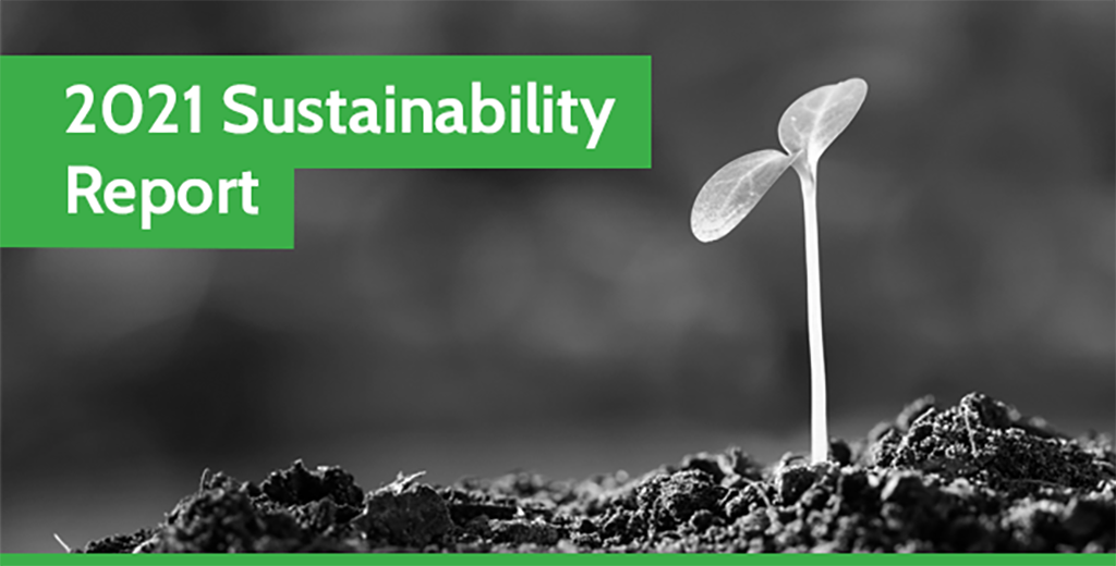 2021 Sustainability Report-new A black and white photo of a plant shoot growing out of soil with a green banner at the top reading '2021 Sustainability Report'.